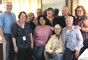 The Scrabble group: Larry Rand, Betsey Wood, Betty Collins, Gerianne Abriano, Sarah King, Cheryl Melvin, Polly Lenzen (seated), Angela Dancho, Barbara Van Alen, and Jula Swaney